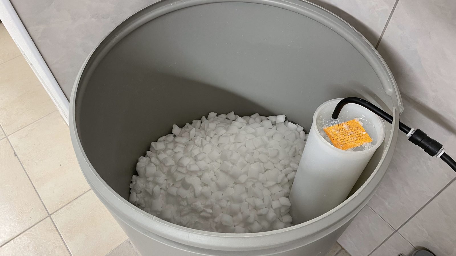 Salt pellets in an open brine tank